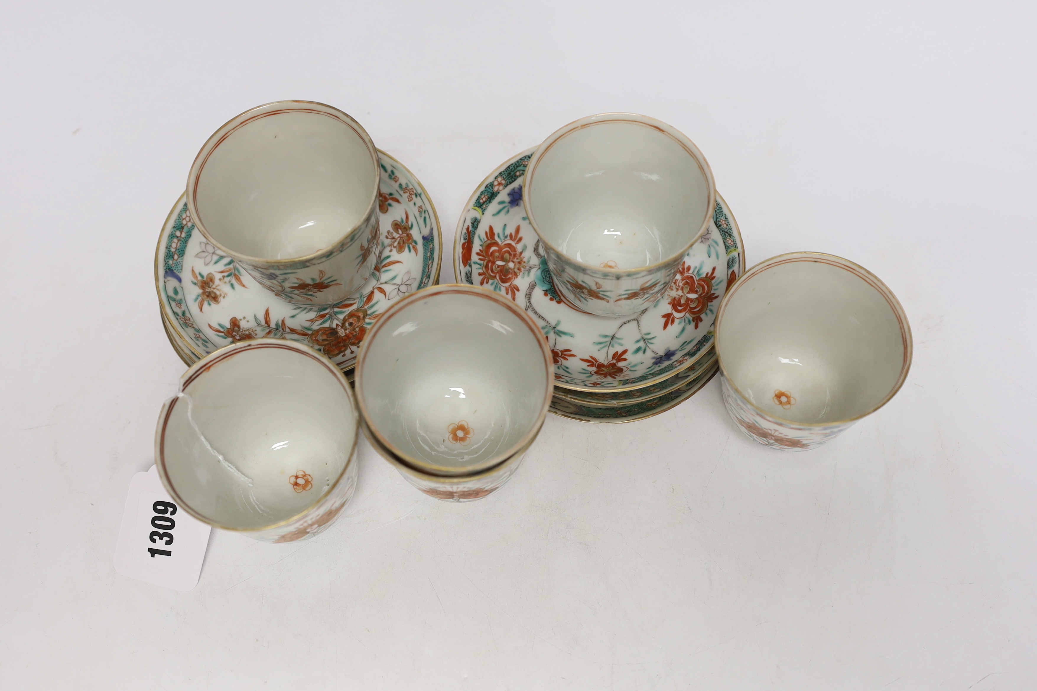 A set of six early 18th century Chinese cups and saucers with Dutch enamelled decoration, c.1710, 7.5cm high